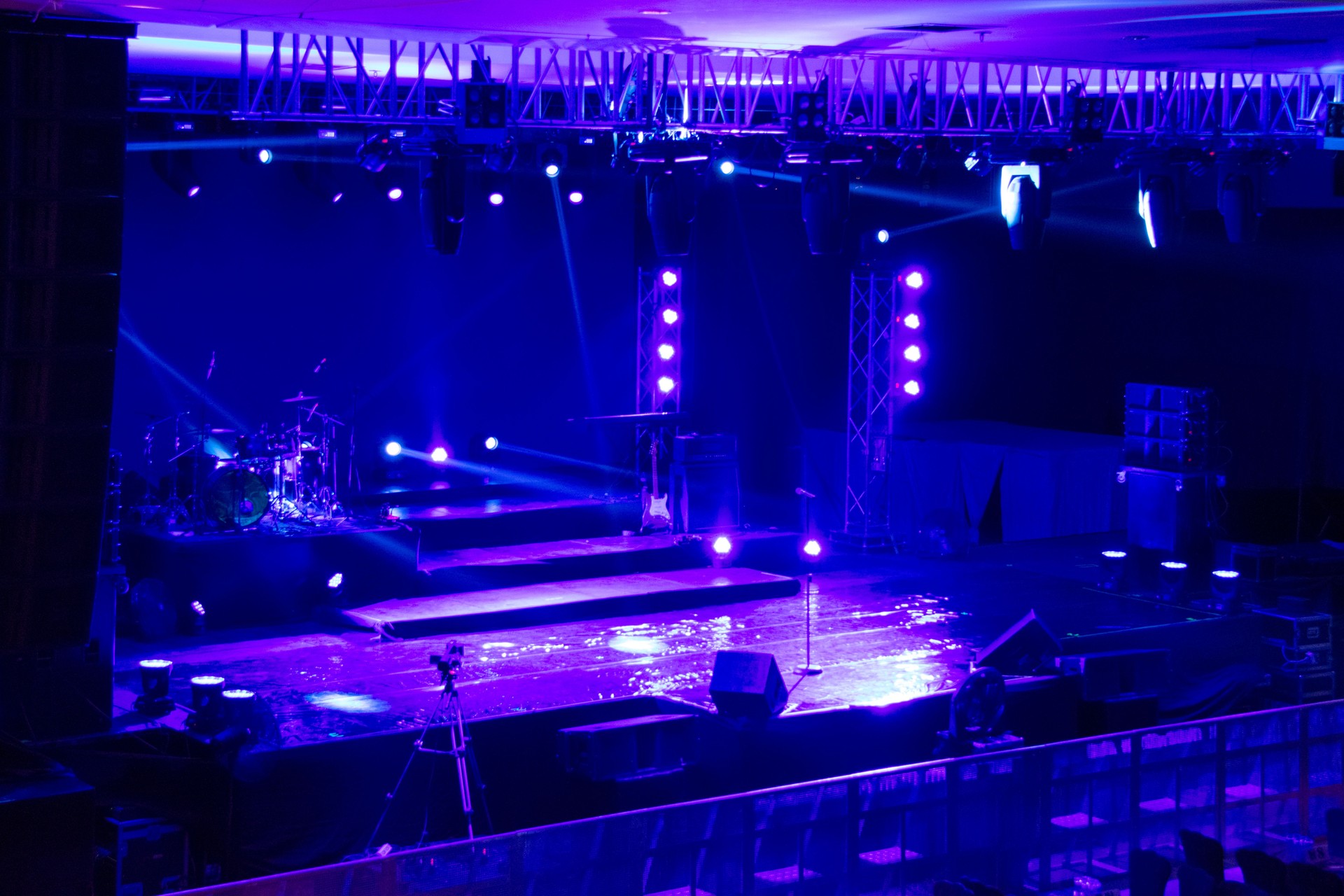 concert lights, illuminated stage in interior space, artificial lighting, musical instruments